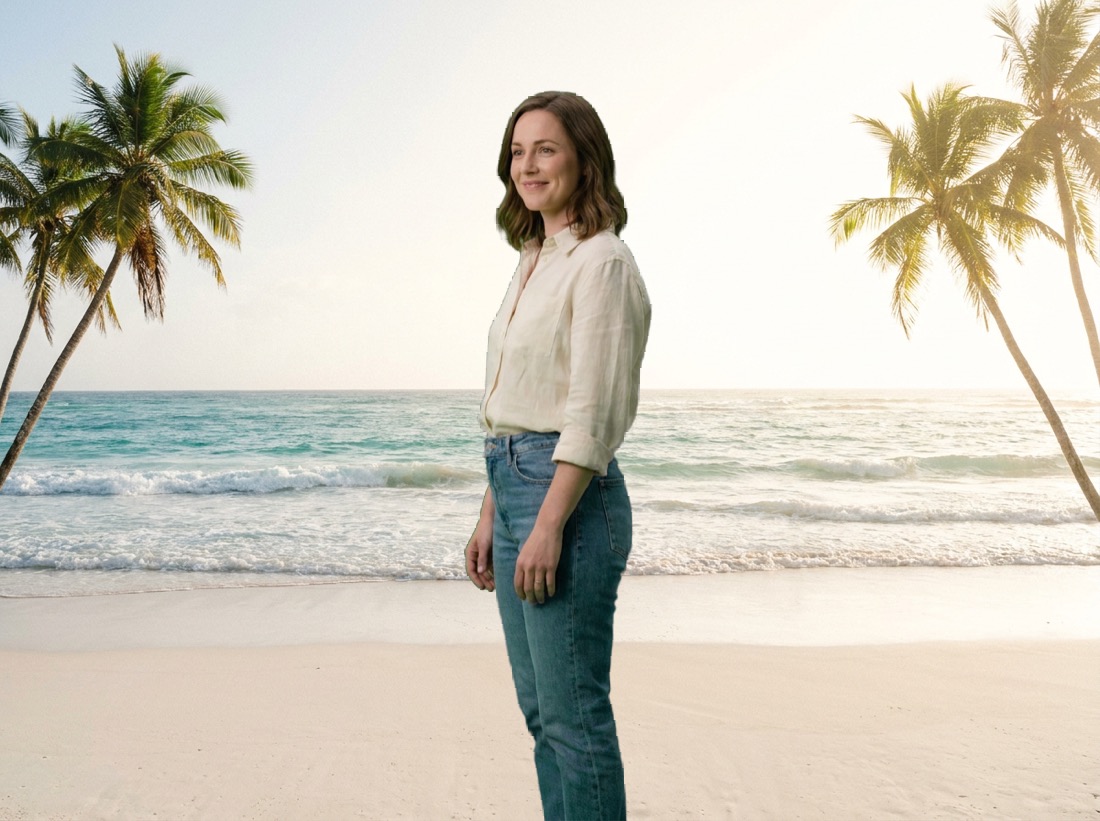 The same woman, with the green backdrop replaced by a sunny beach scene.